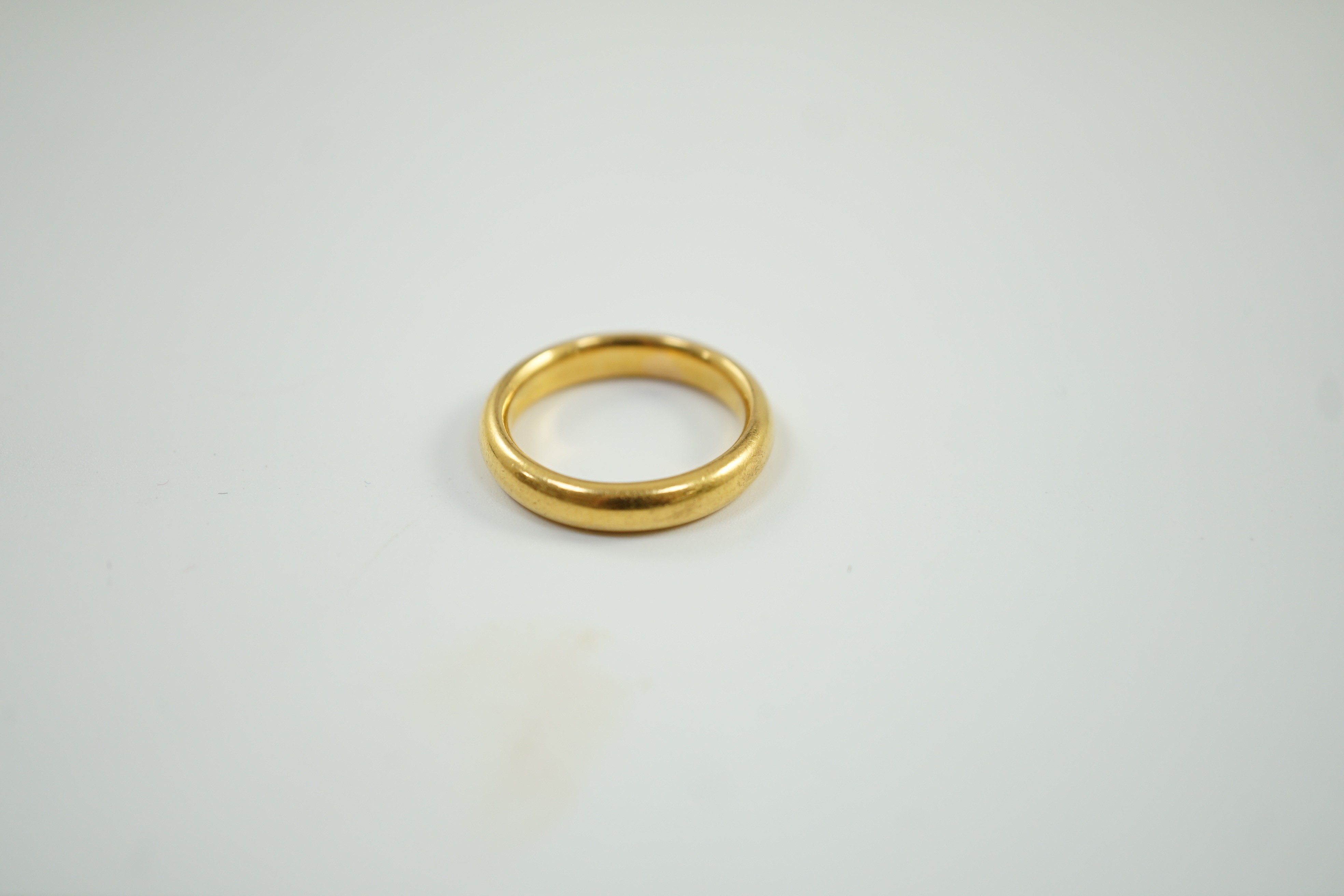 A 1930's 22ct gold wedding band, size M, 7.8 grams.